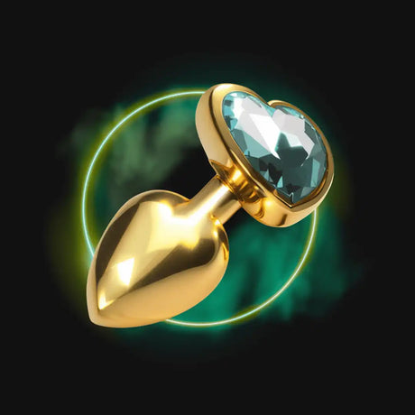 Golden heart-shaped anal plug with a blue gem.