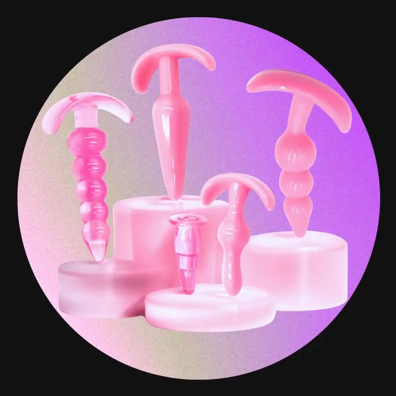 Pink, T-shaped anal plugs.